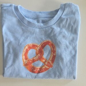 art class Light Blue Tee with Orange Pretzel Graphic